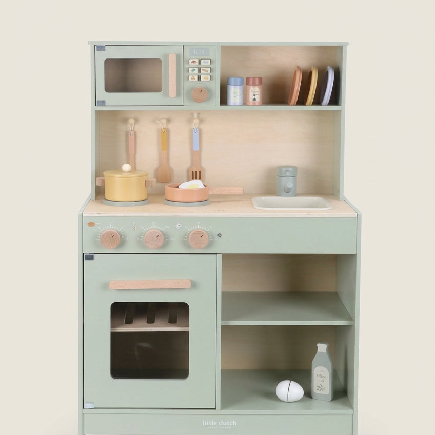 Children's play kitchen set with various accessories on a white background