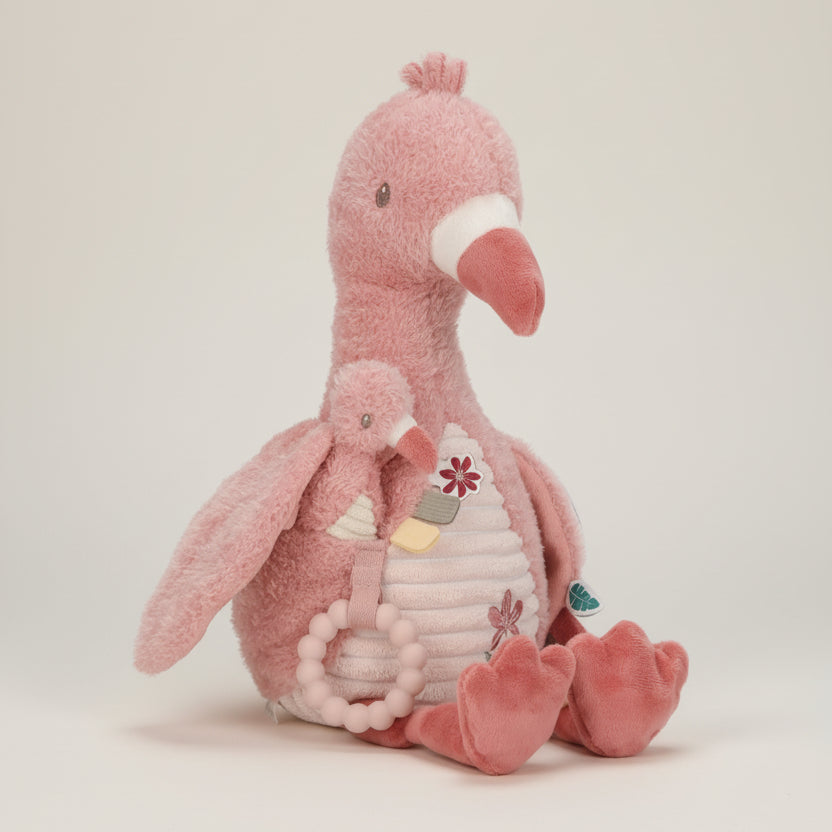 Pink plush flamingo toy with a baby flamingo and rattle on a white background