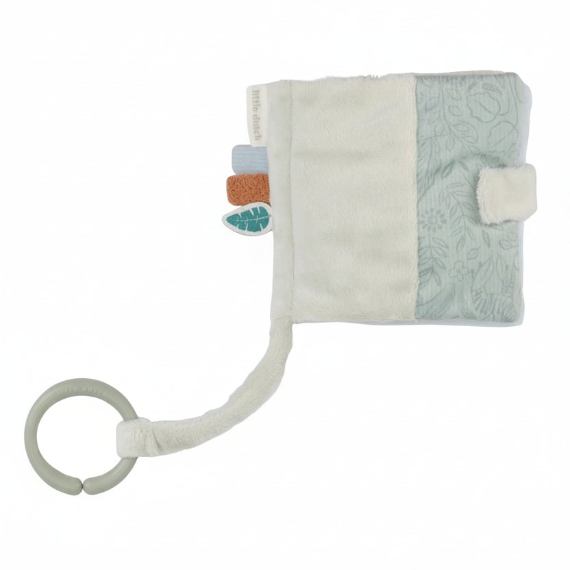 Baby comfort booklet with rattle and soft textures on a white background