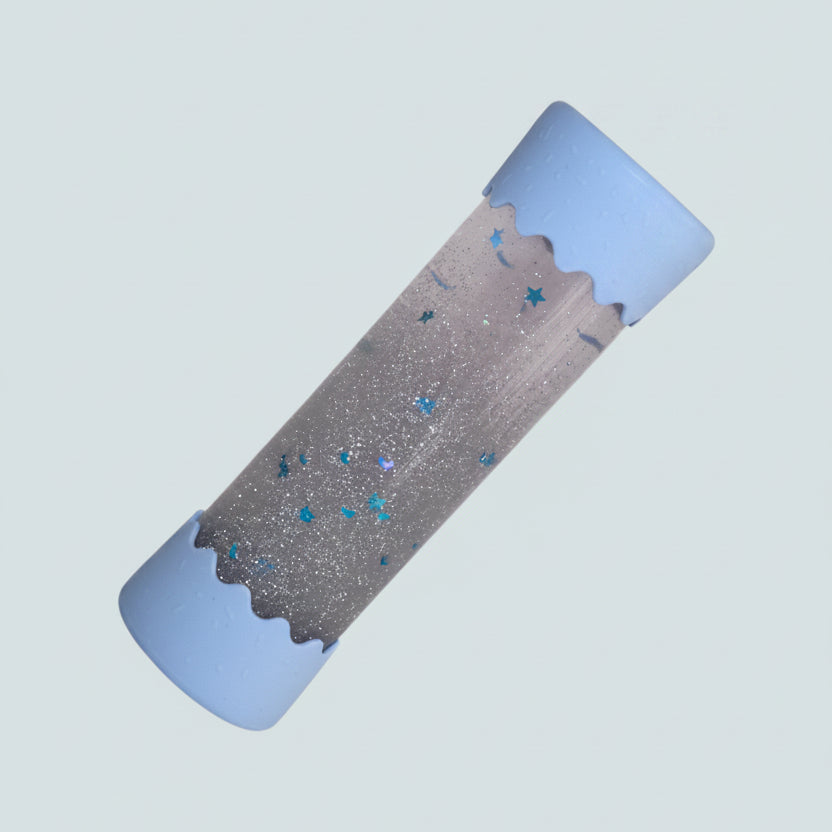Baby Calm Bottle with blue edges on blue background