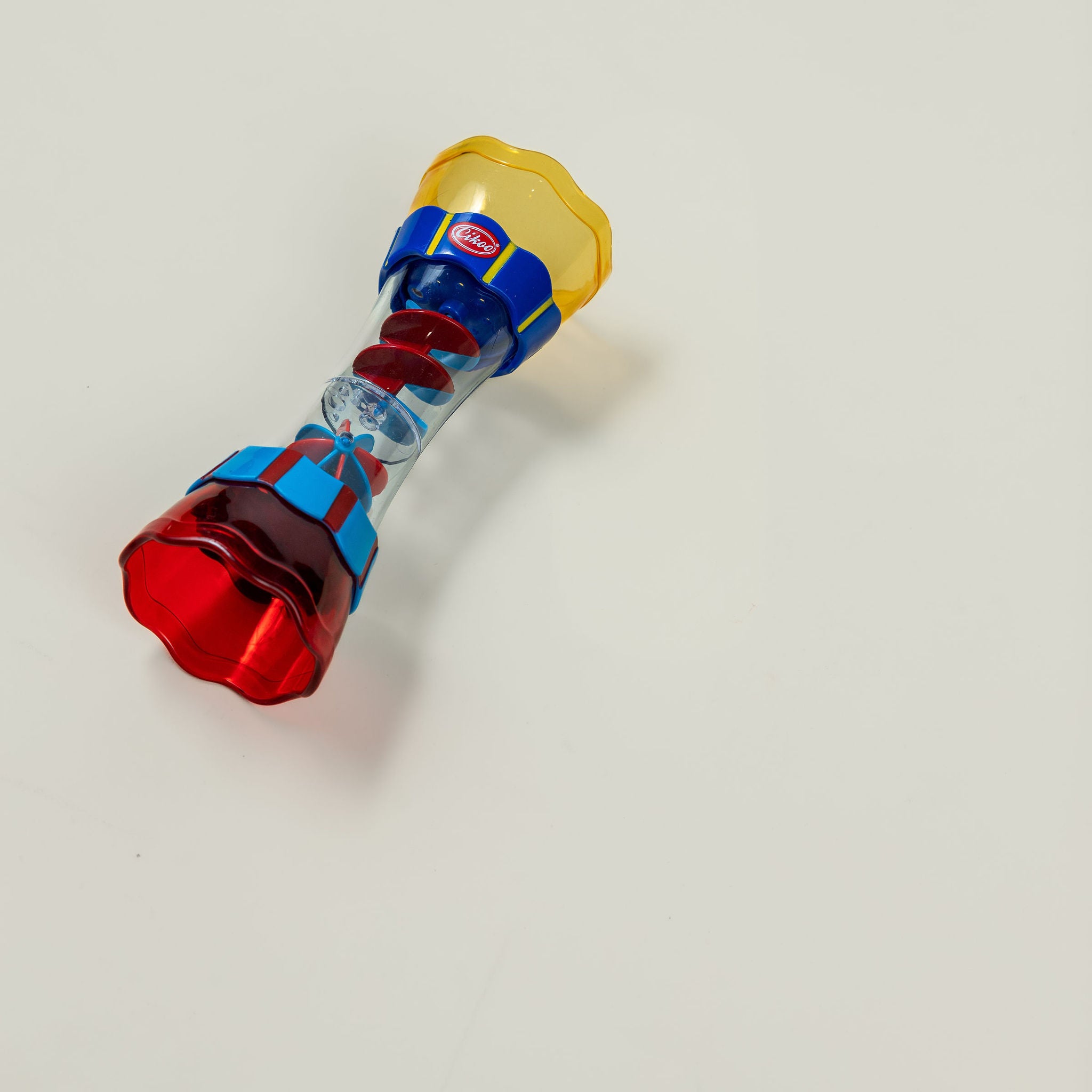 Rain maker toy spinning on smooth surface