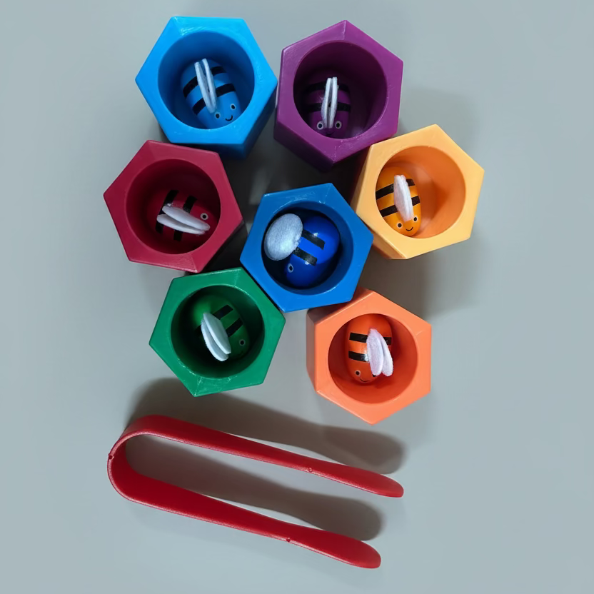 A set of colorful plastic bird feeder cups in blue, purple, red, orange, green, and dark blue, each containing bird seed, accompanied by a red scoop, arranged on a light blue background.