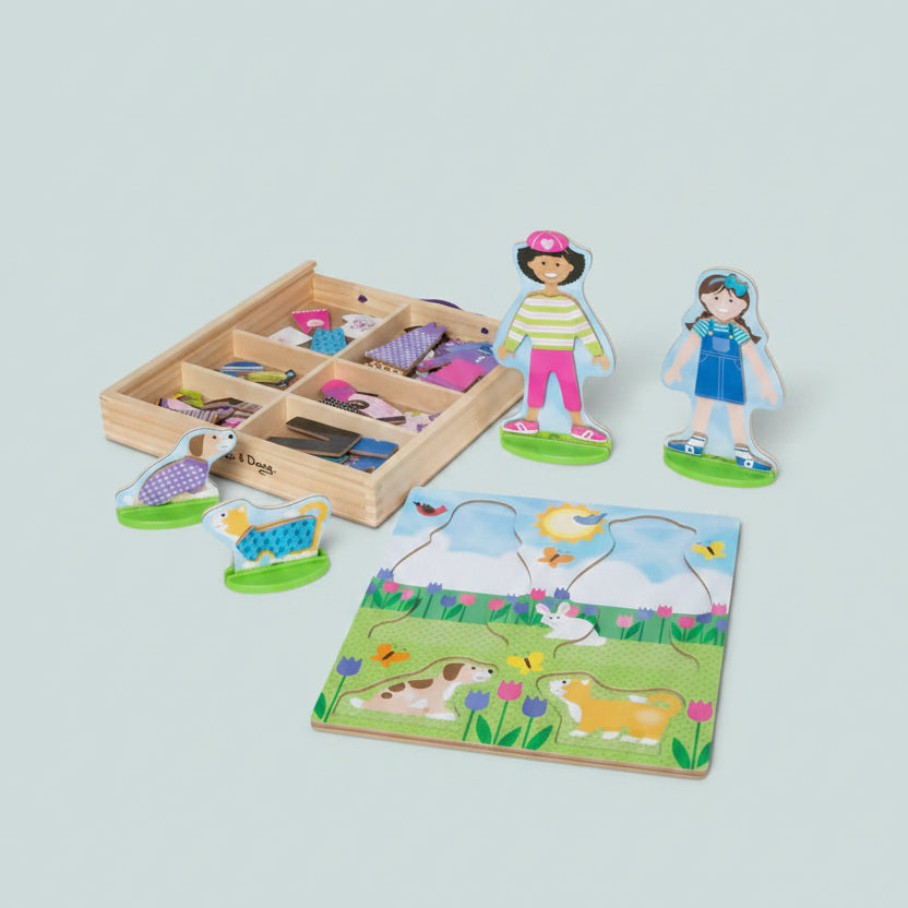 Wooden toy set with figures, a puzzle, and a box on a white background