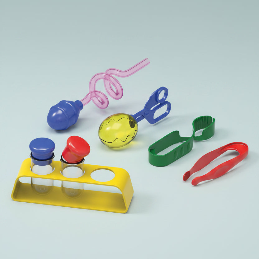 Colorful set of sensory play tools including a blue and red tool, yellow ball, green clip, and more on a white background.
