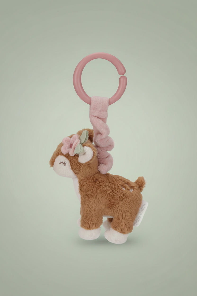 Plush deer toy with pink rattle on a white background