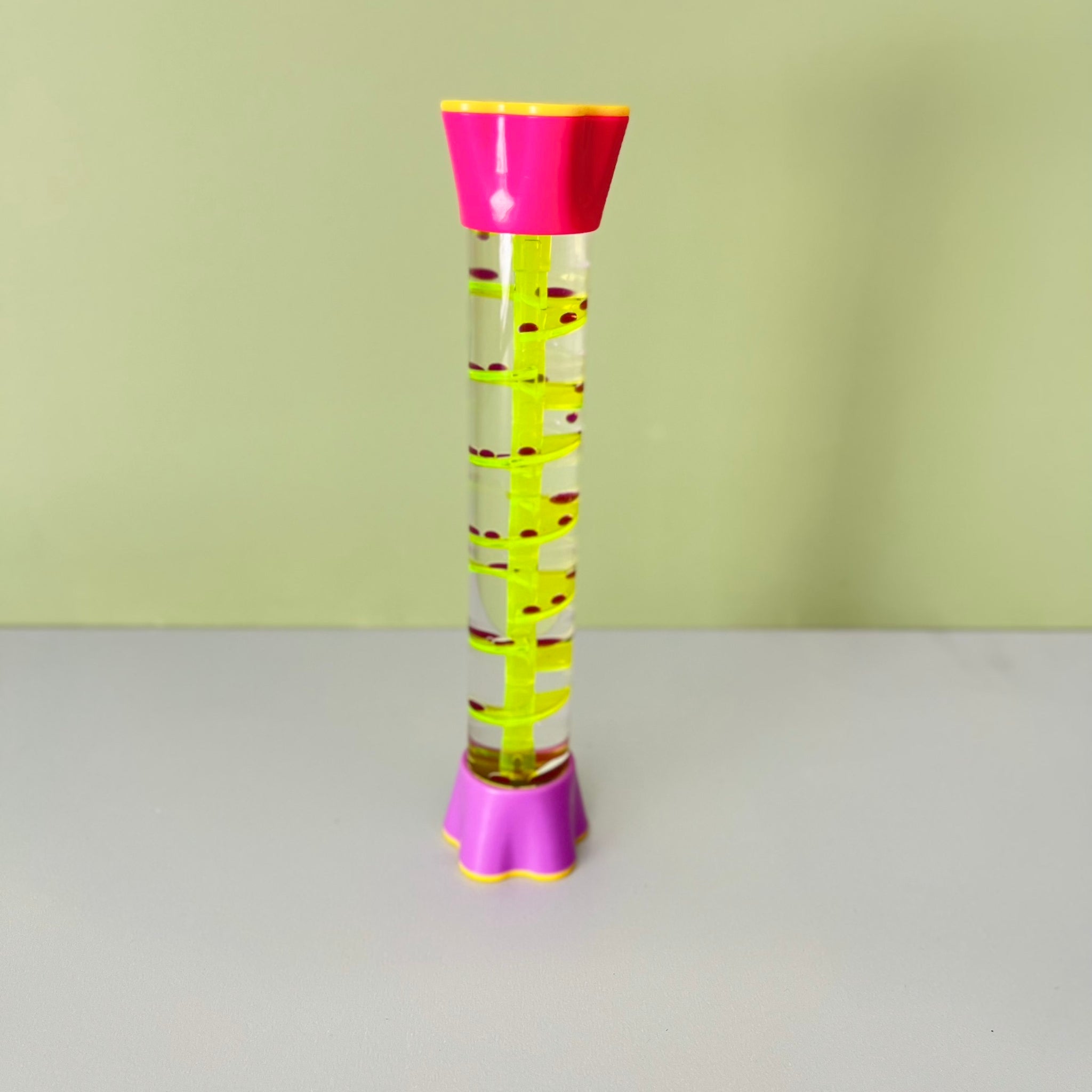 Sensory liquid timer with slow moving oil droplets