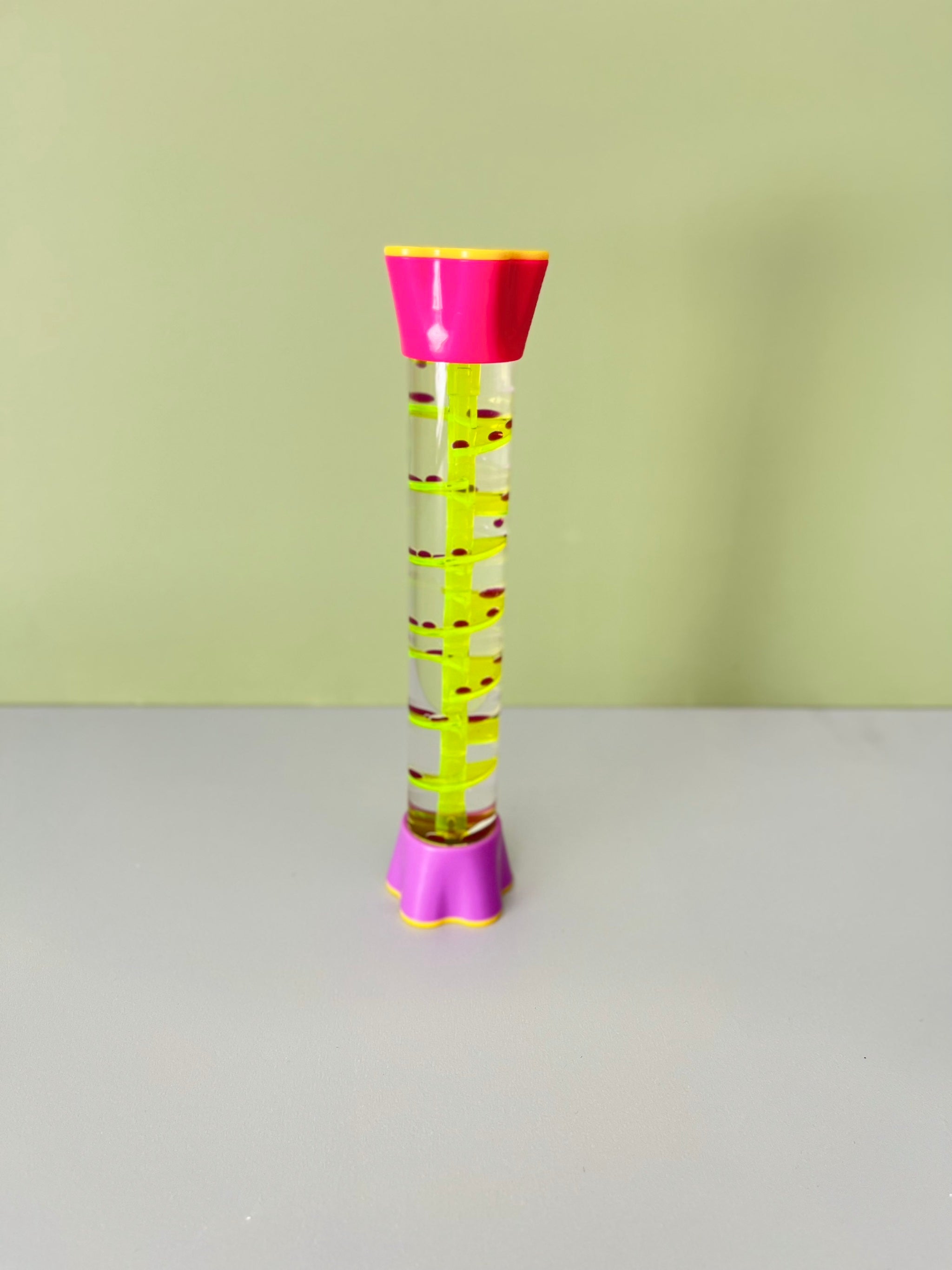 Sensory liquid timer with slow moving oil droplets