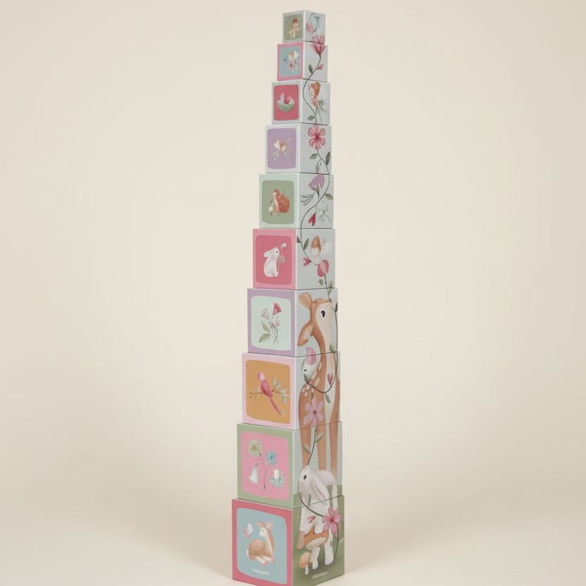 Stack of colorful children's blocks with animal illustrations on a white background