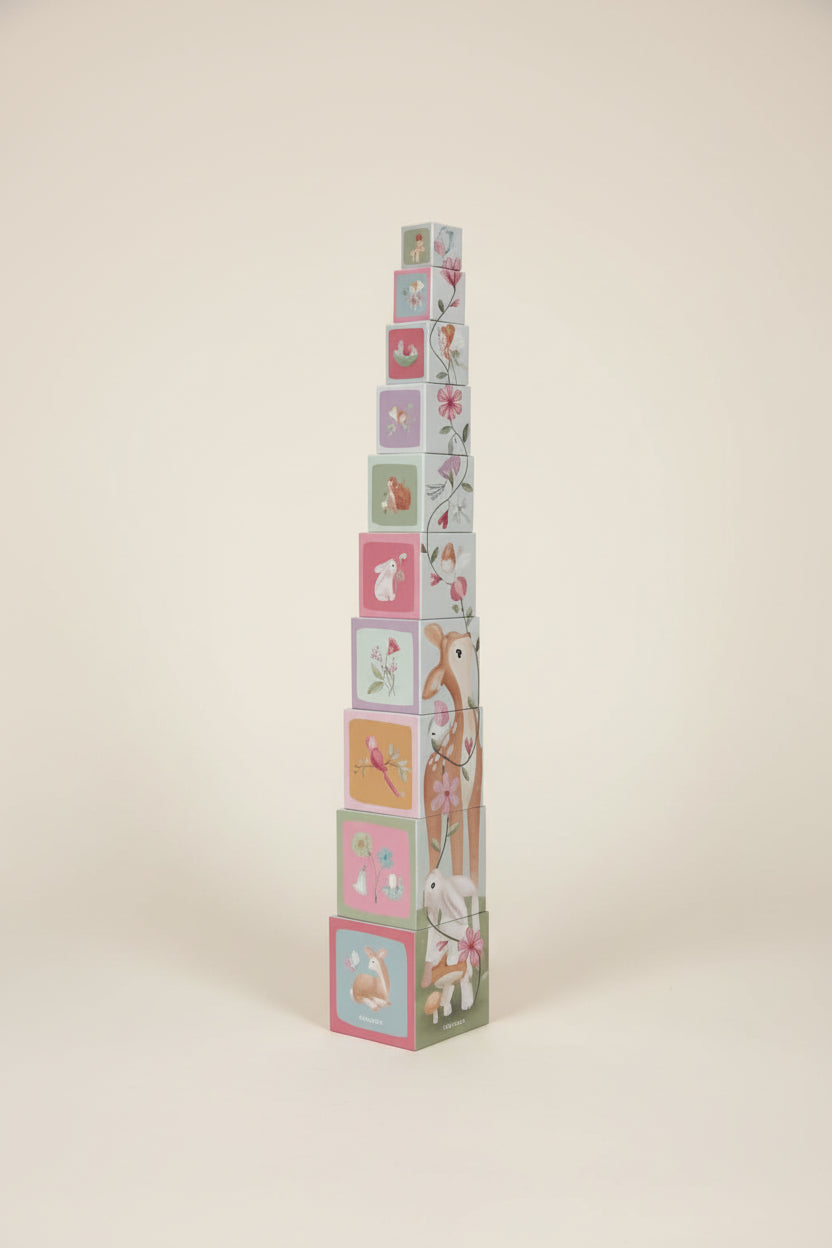 Stack of colorful children's blocks with animal illustrations on a white background
