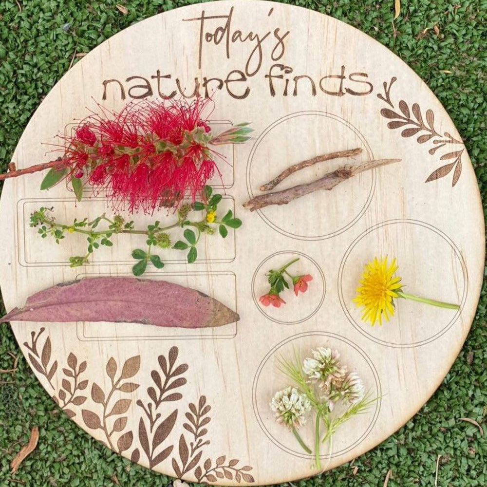 Kids using nature hunt board during outdoor play
