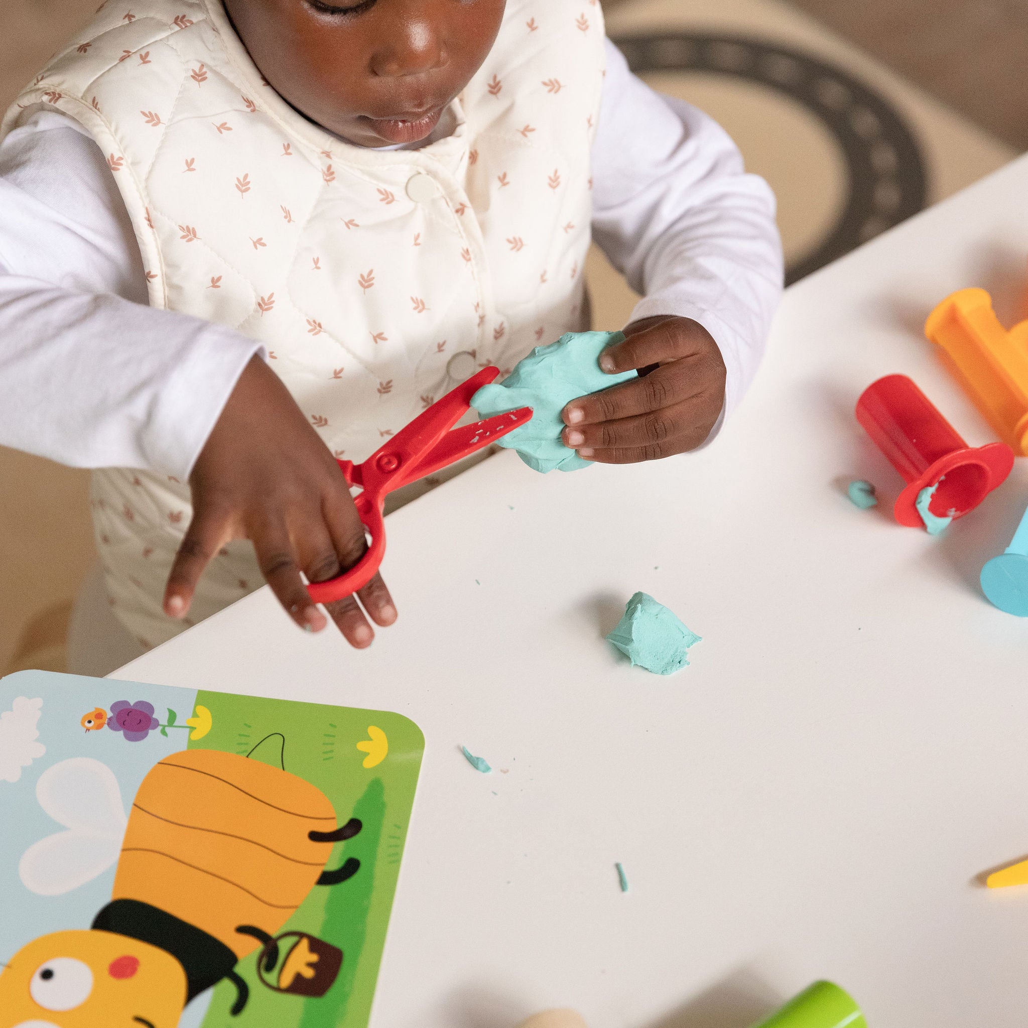 Red play-dough scissors for fine motor development