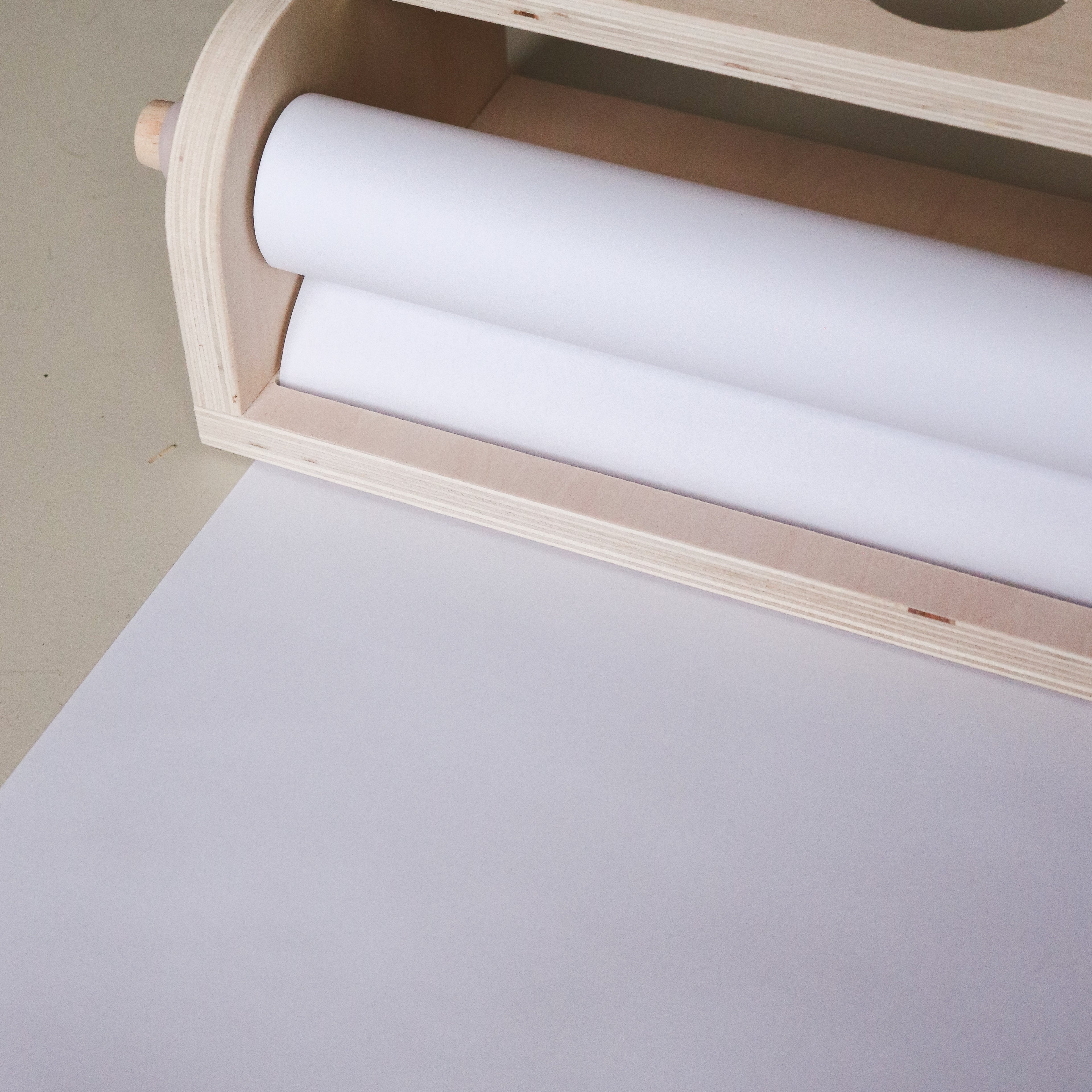 Table top paper dispenser with paper