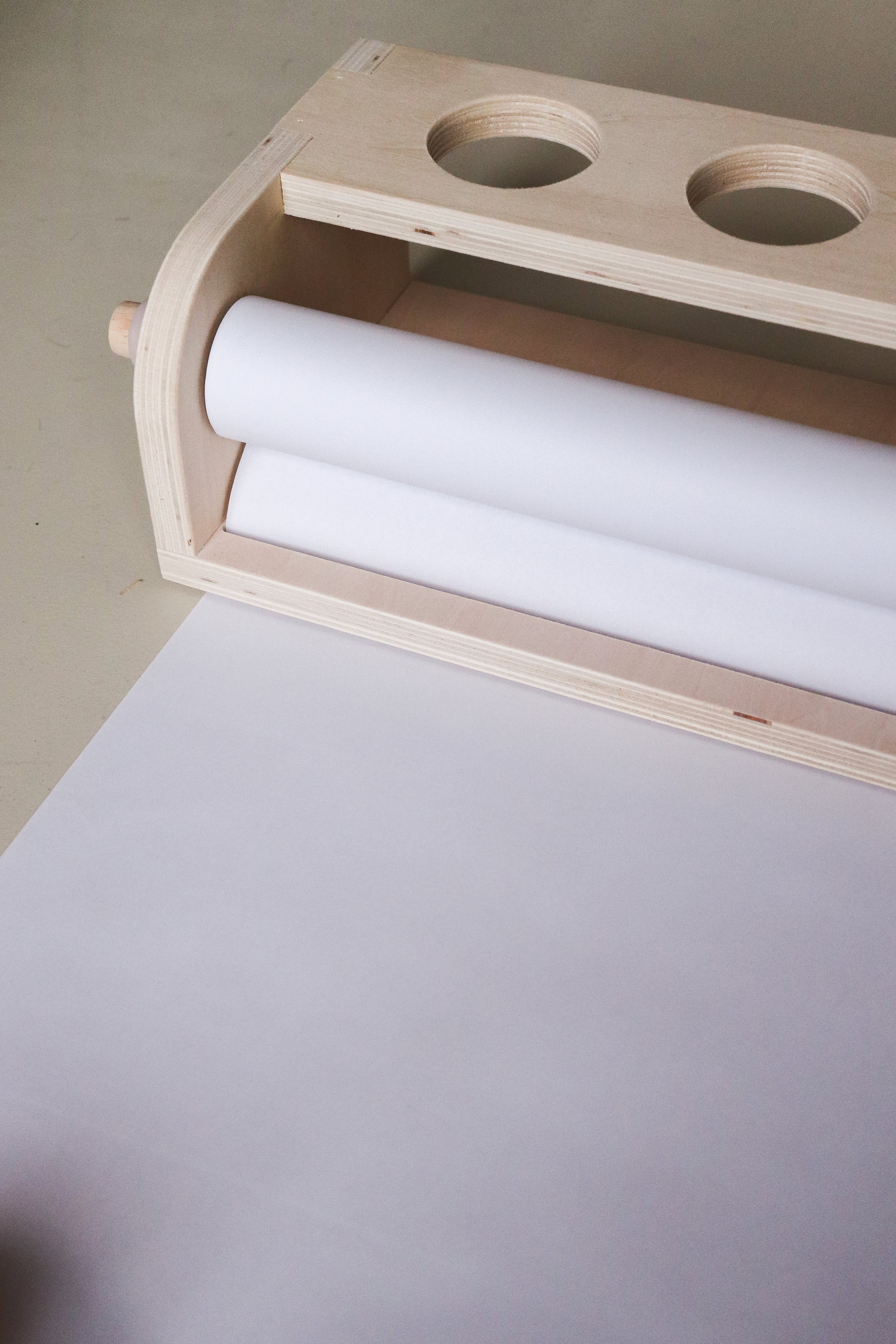 Table top paper dispenser with paper