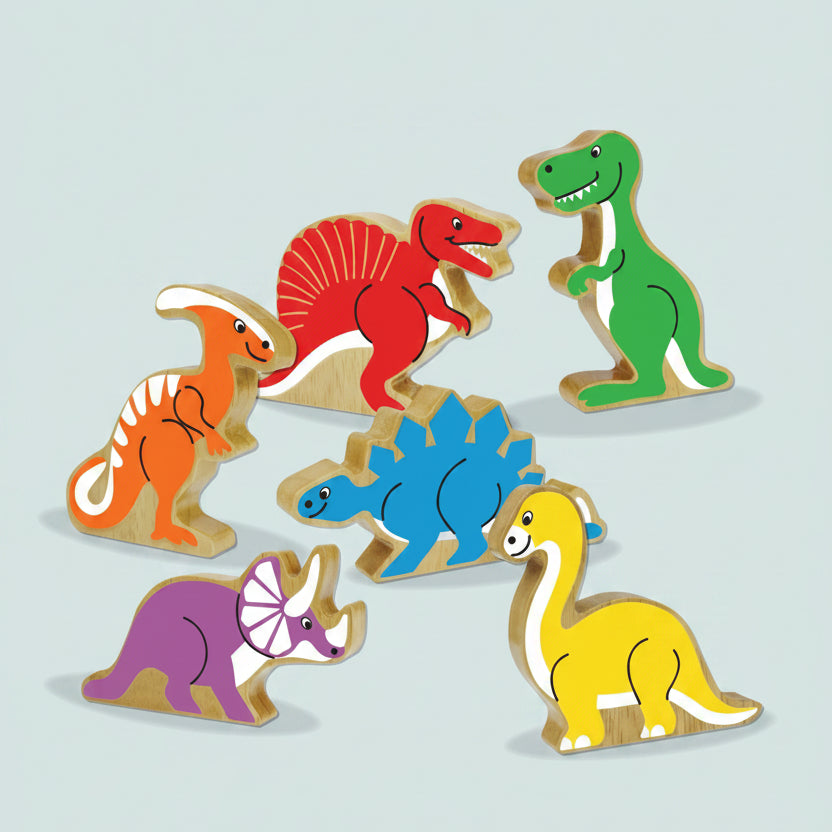A set of colorful wooden dinosaur toy figures on a plain white background. The set includes a green T-rex, red spinosaurus, orange ornithopod, blue Stegosaurus, purple Triceratops, and yellow Brachiosaurus.