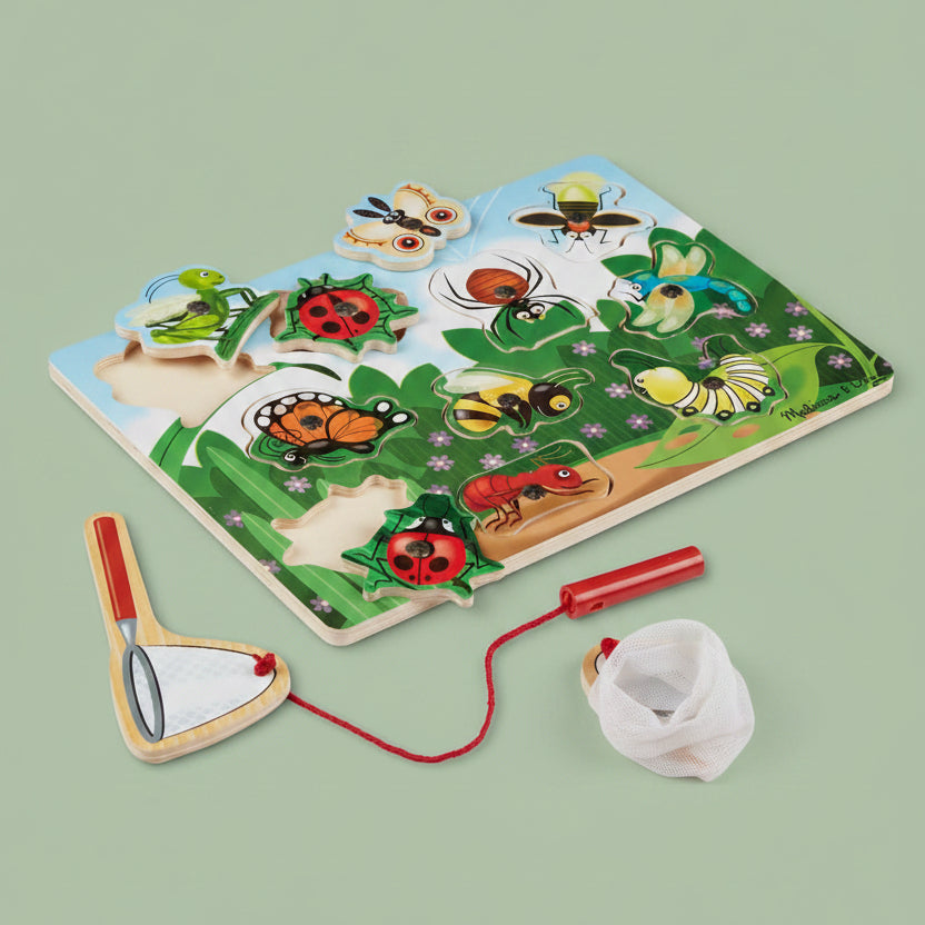 A children's wooden insect puzzle board with colorful insect pieces and a red-and-beige butterfly net, shown on a white background.