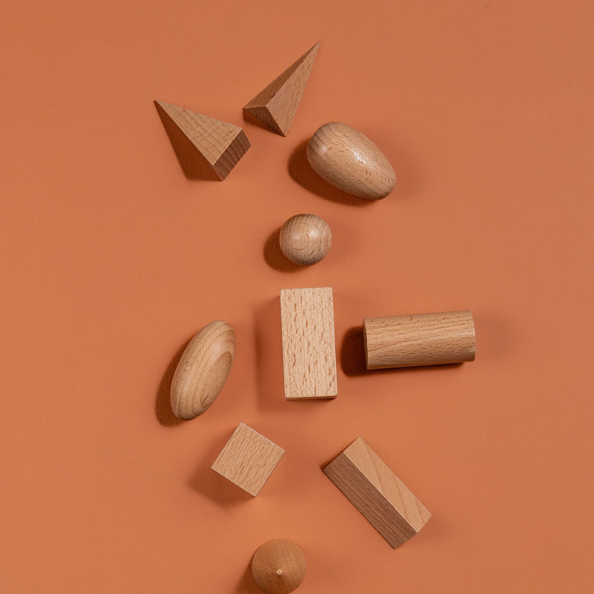 Montessori-inspired wooden geometric solids set