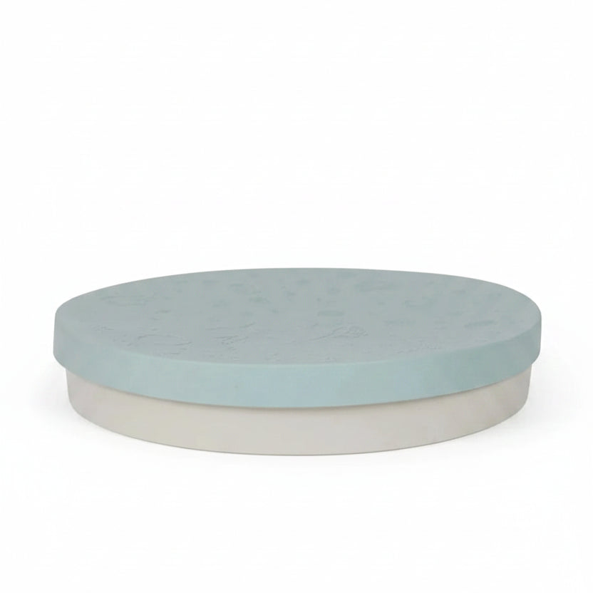 round sensory tray in light blue with a divider lid