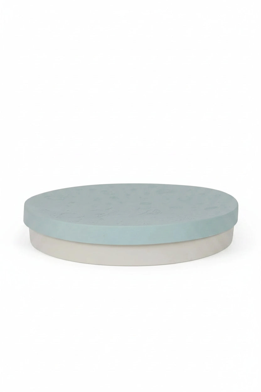 round sensory tray in light blue with a divider lid