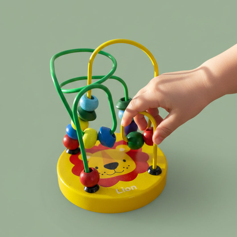 Colorful lion-shaped bead maze toy on a wooden surface