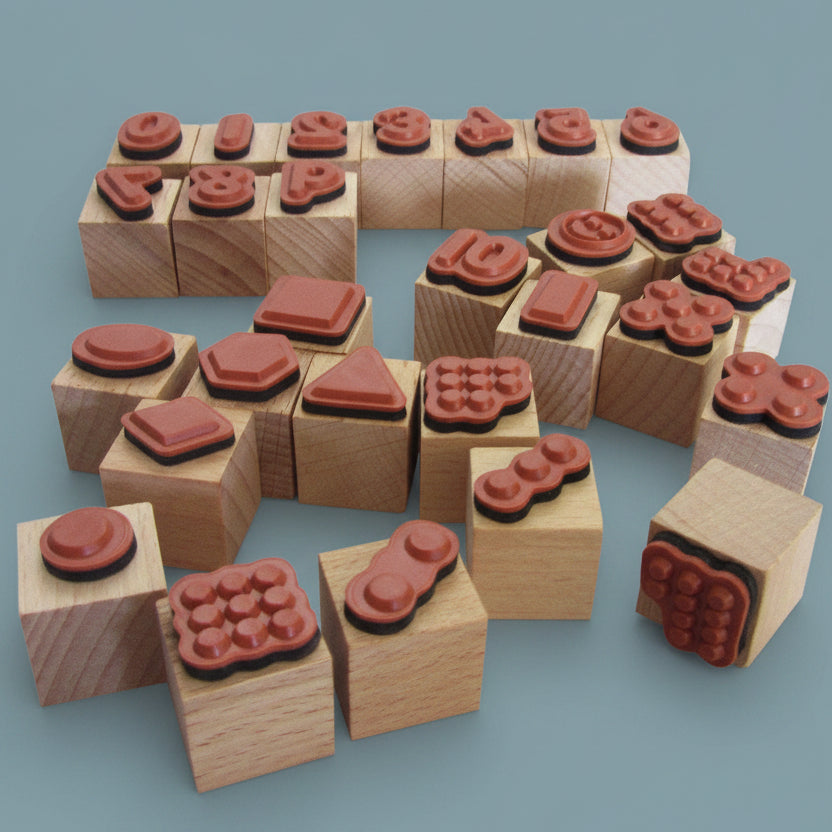 Set of wooden blocks with red stamp-like designs numbers, dots and shapers