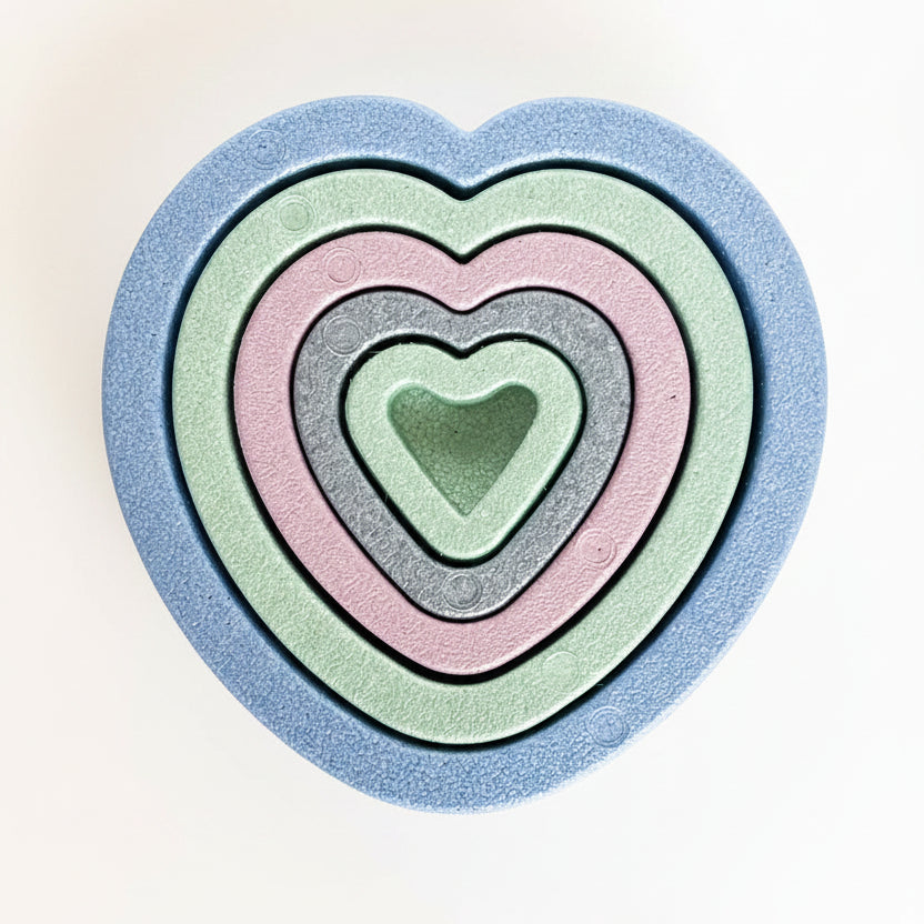 nesting hearts on stone background