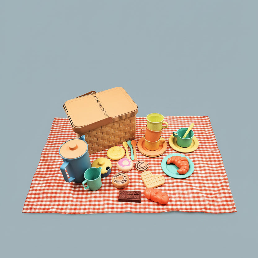 Miniature picnic set with a basket, cups, plates, and food items on a red and white checkered cloth.