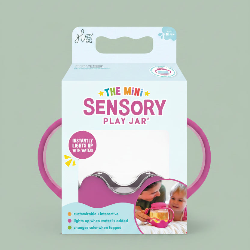 Package of 'The Mini Sensory Play Jar' with pink handles on a white background