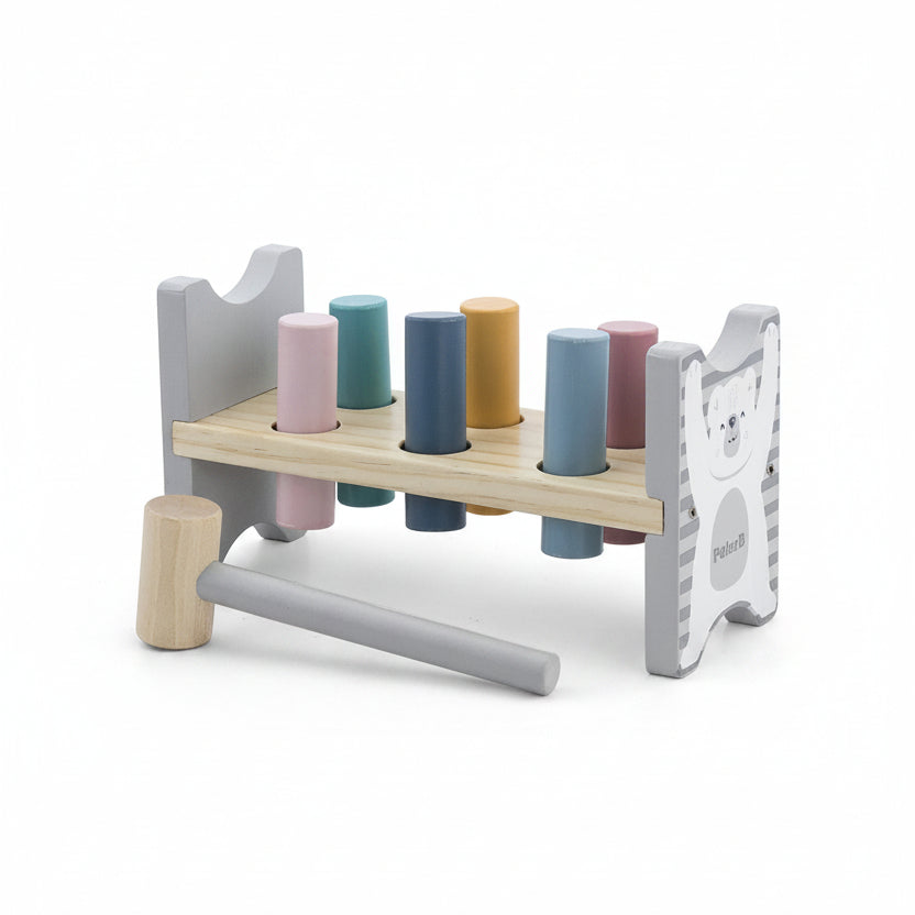 A wooden toy hammer set with a peg rack, shown on a white background with dimension lines indicating 200mm width, 105mm height, and 70mm depth. The set includes a natural wood mallet, pegs in pink, teal, blue, yellow, and purple, and a bear-themed side panel.