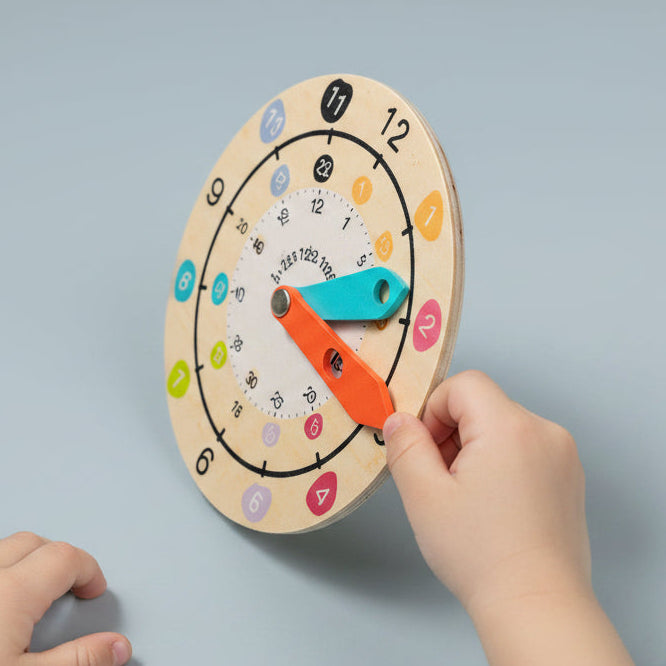Close-up of wooden teaching clock face showing numbered dial and movable hands — OT-recommended time teaching toy