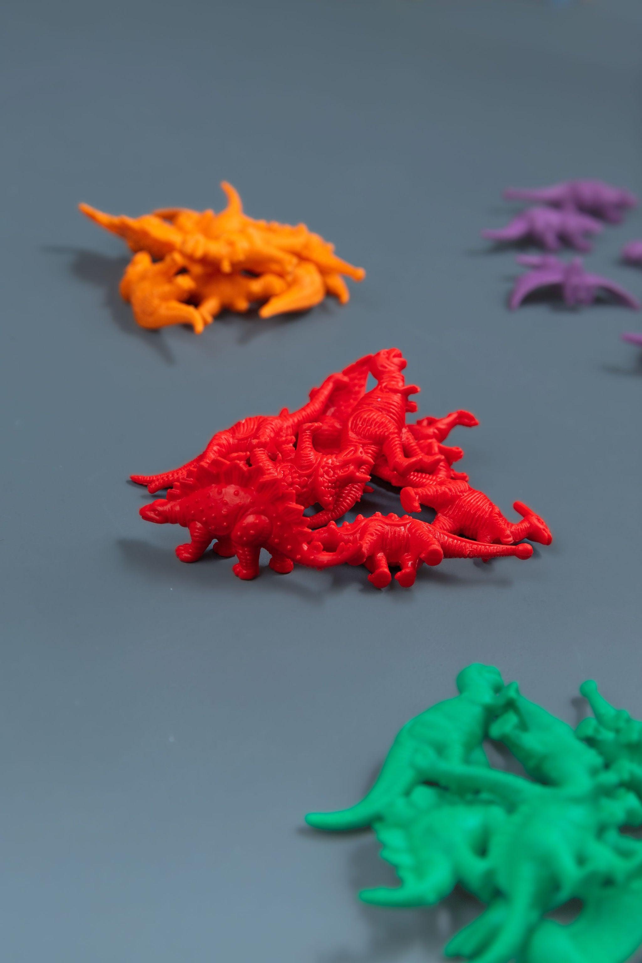 Dinosaur counters set of 48 in multiple colours for counting, sorting and imaginative play