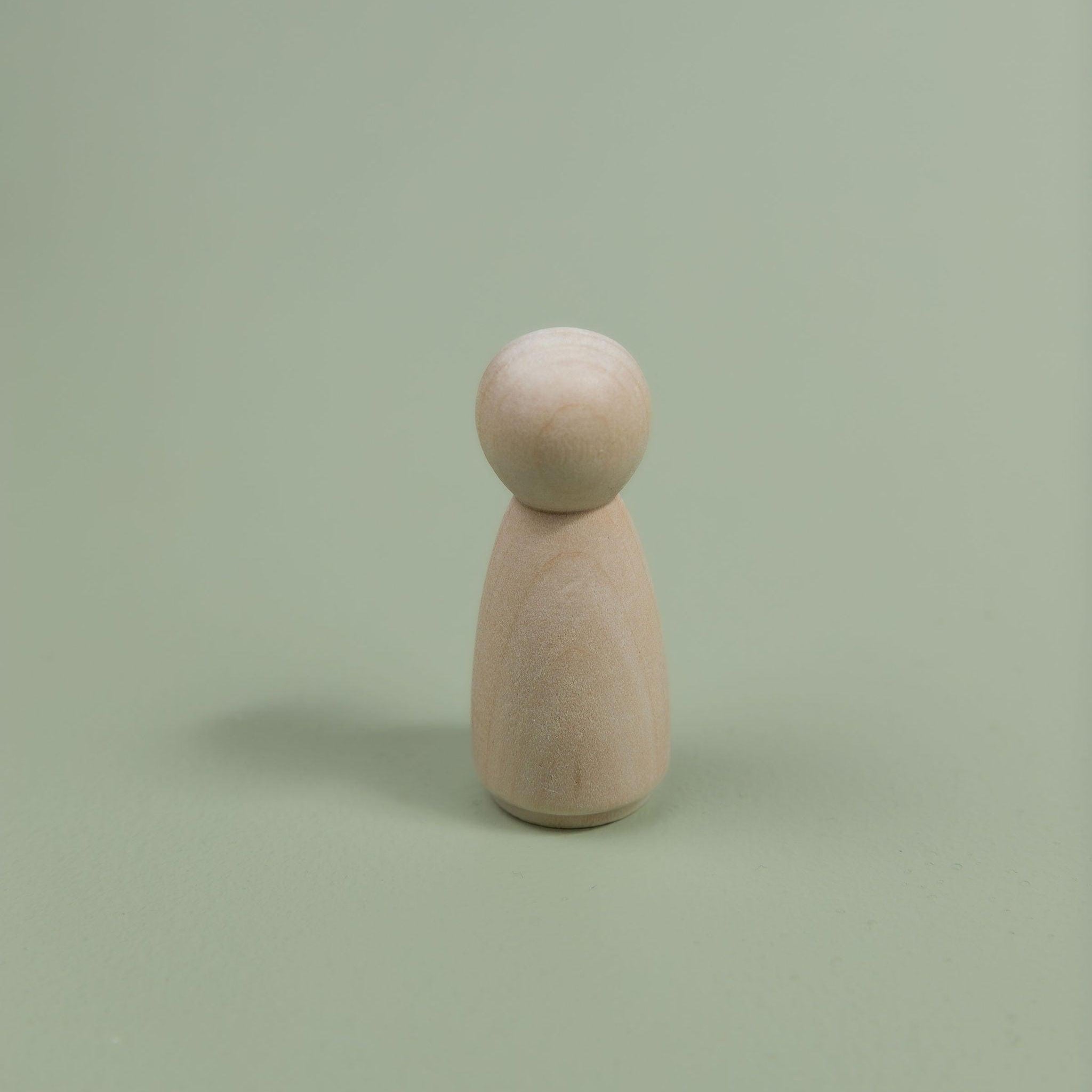Minimalist wooden peg dolls for open-ended play