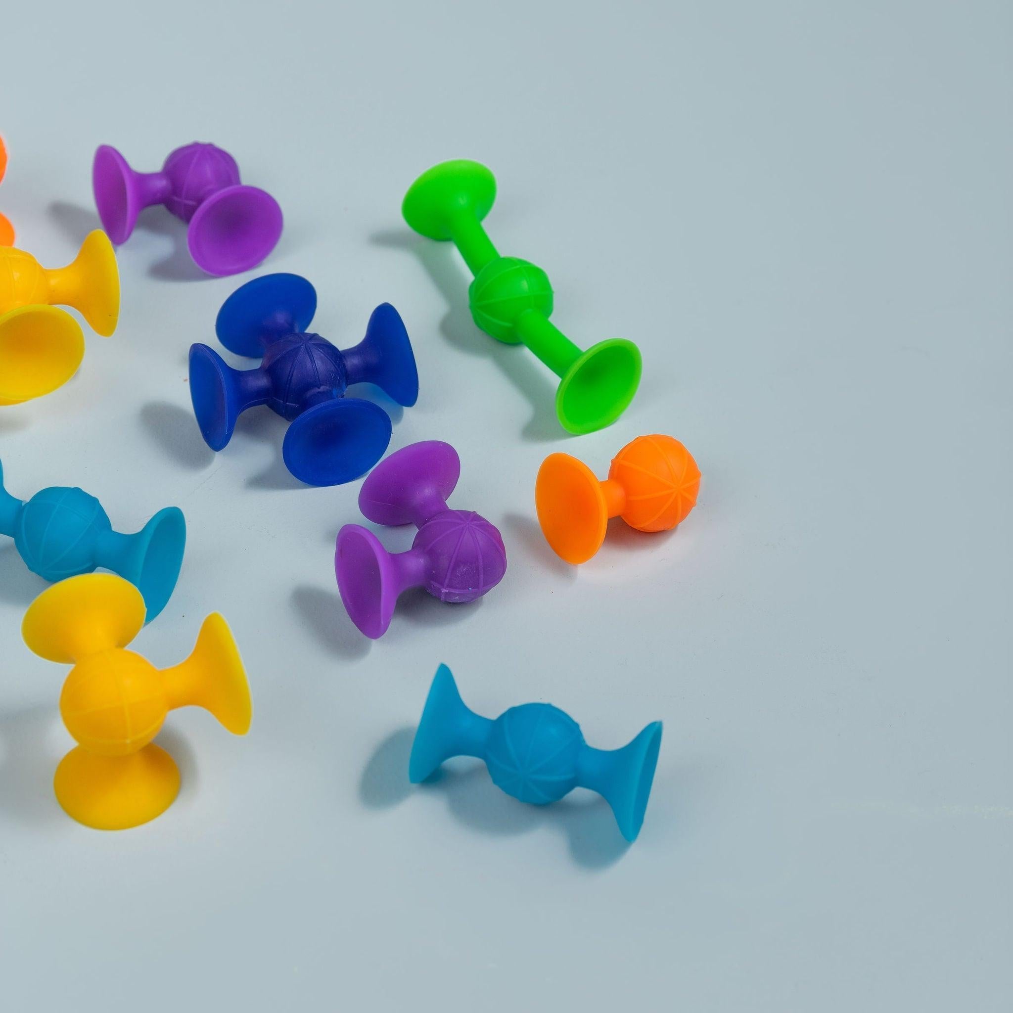 Colourful suction toys connecting and building shapes