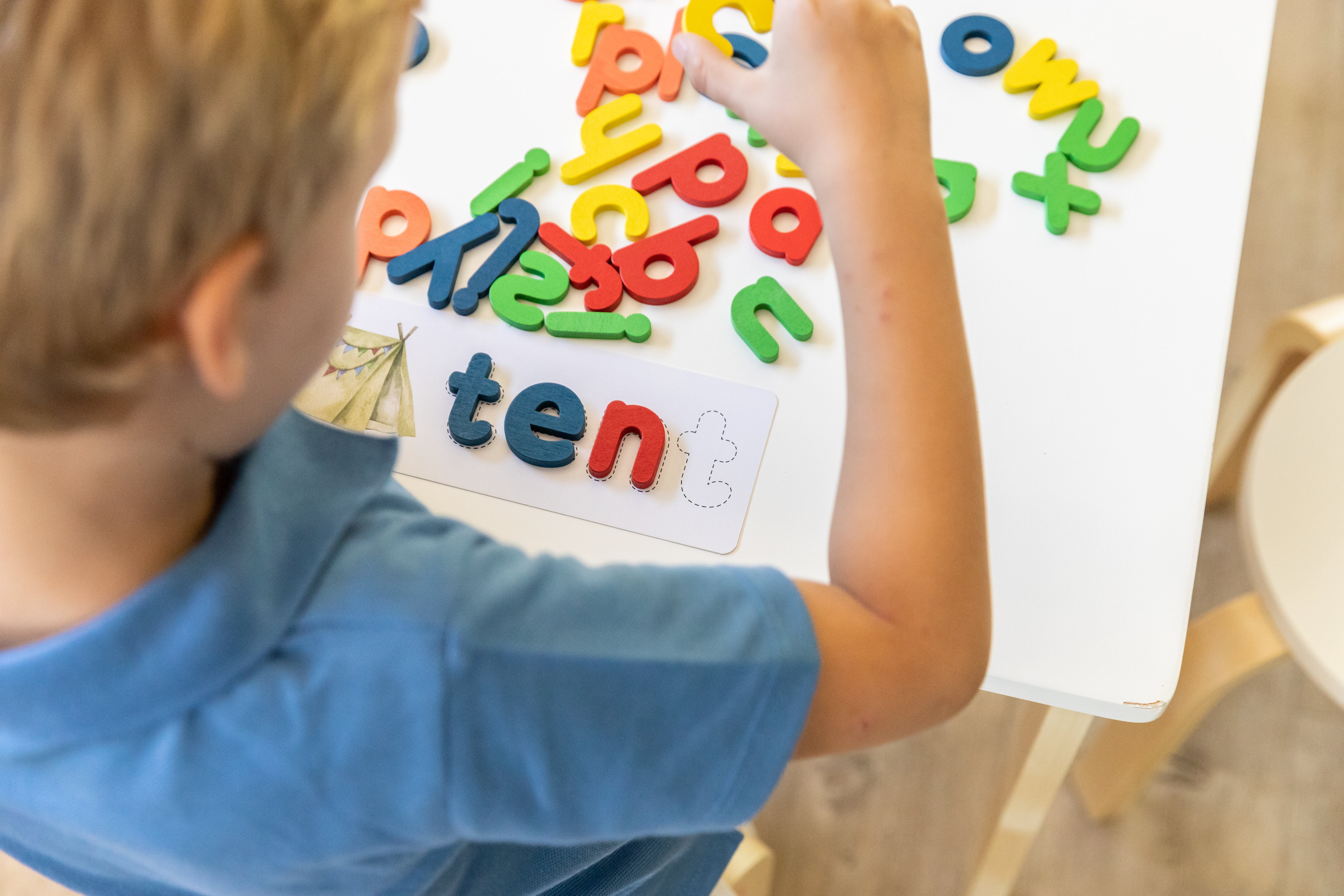 Children developing language and early reading skills through play-based learning activities