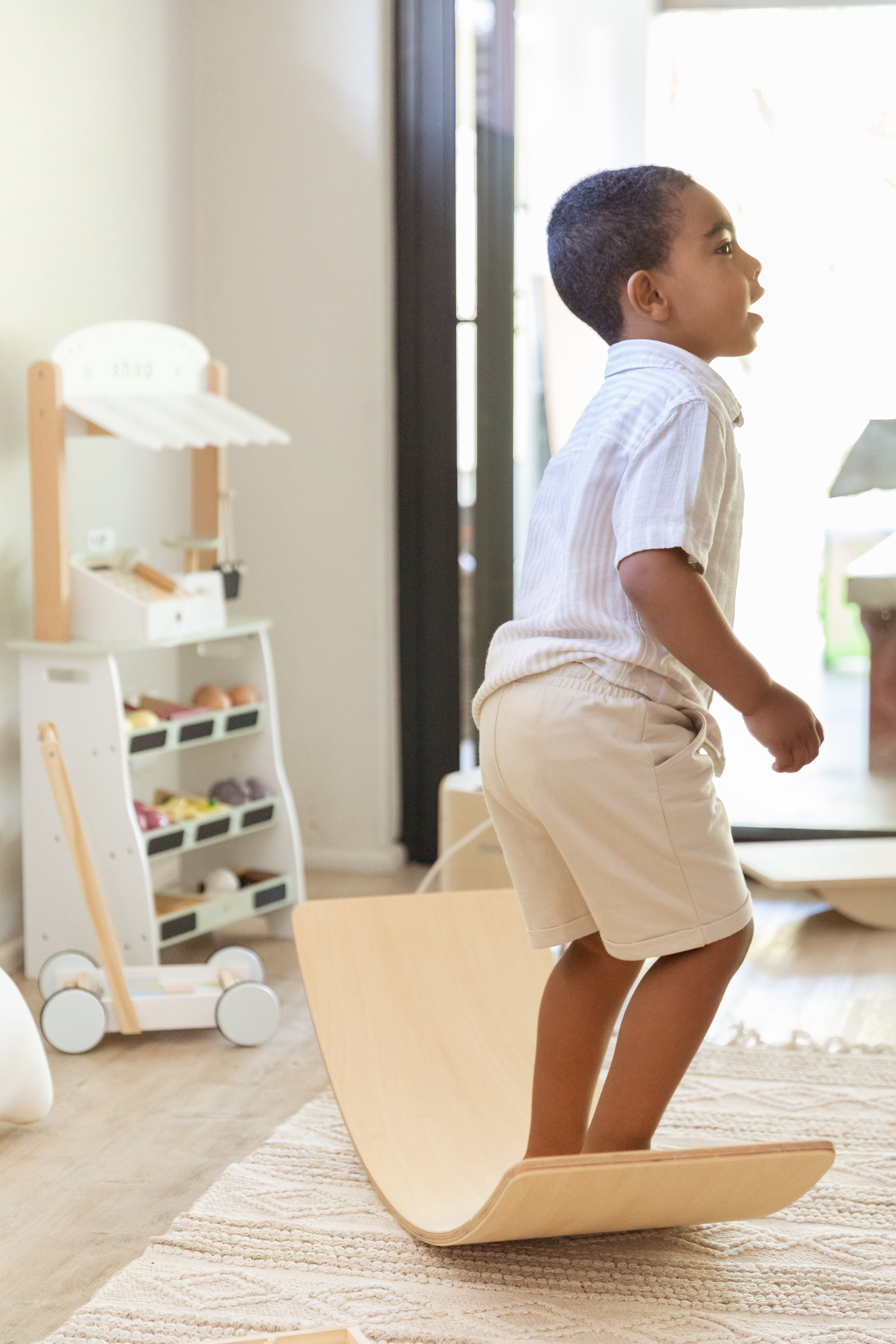 Children playing with gross motor toys to develop balance, coordination, and movement skills