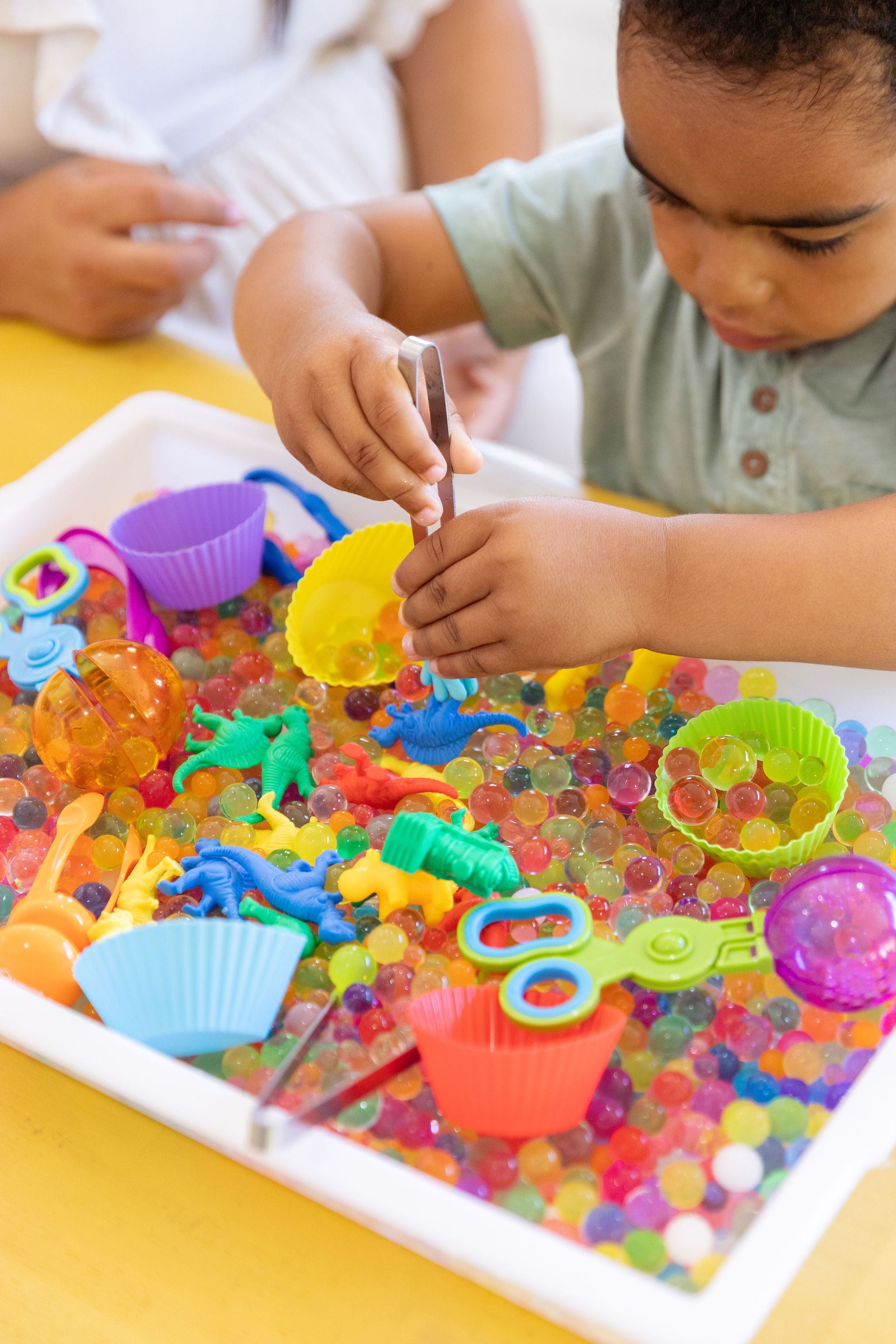 Children engaging in sensory play to support sensory processing and regulation