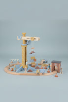 Wooden toy railway set with various pieces on a white background
