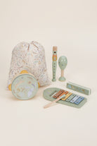 Set of children's musical instruments with a drawstring bag on a white background