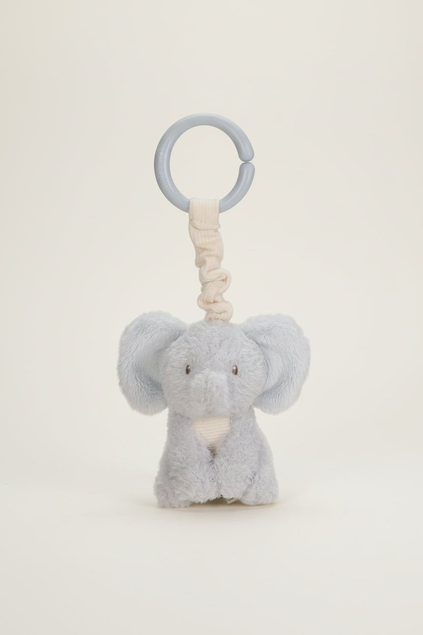Plush elephant toy with a ring on a white background