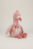 Pink plush flamingo toy with a baby flamingo and rattle on a white background