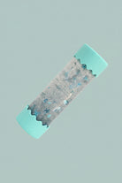 Baby Calming play bottles with turquoise edges on a blue  background