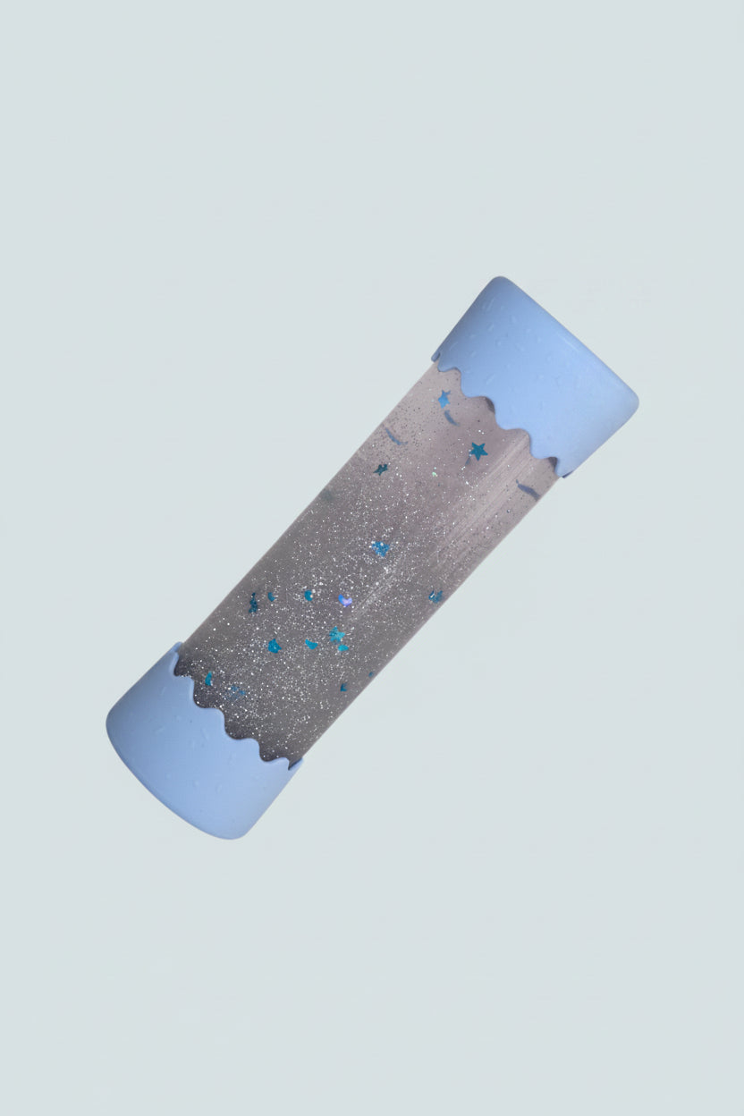 Baby Calm Bottle with blue edges on blue background