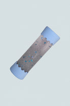 Baby Calm Bottle with blue edges on blue background