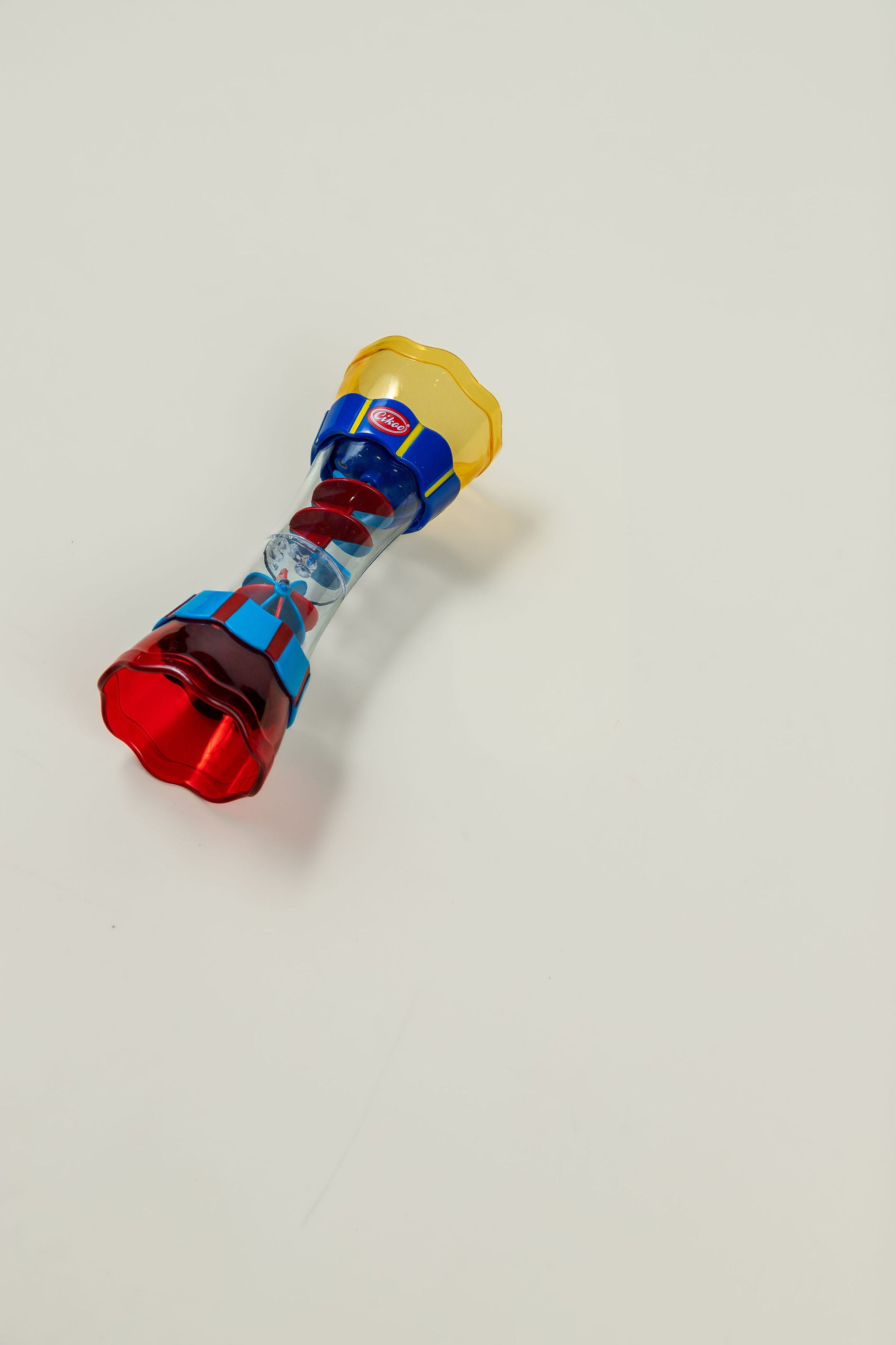 Rain maker toy spinning on smooth surface