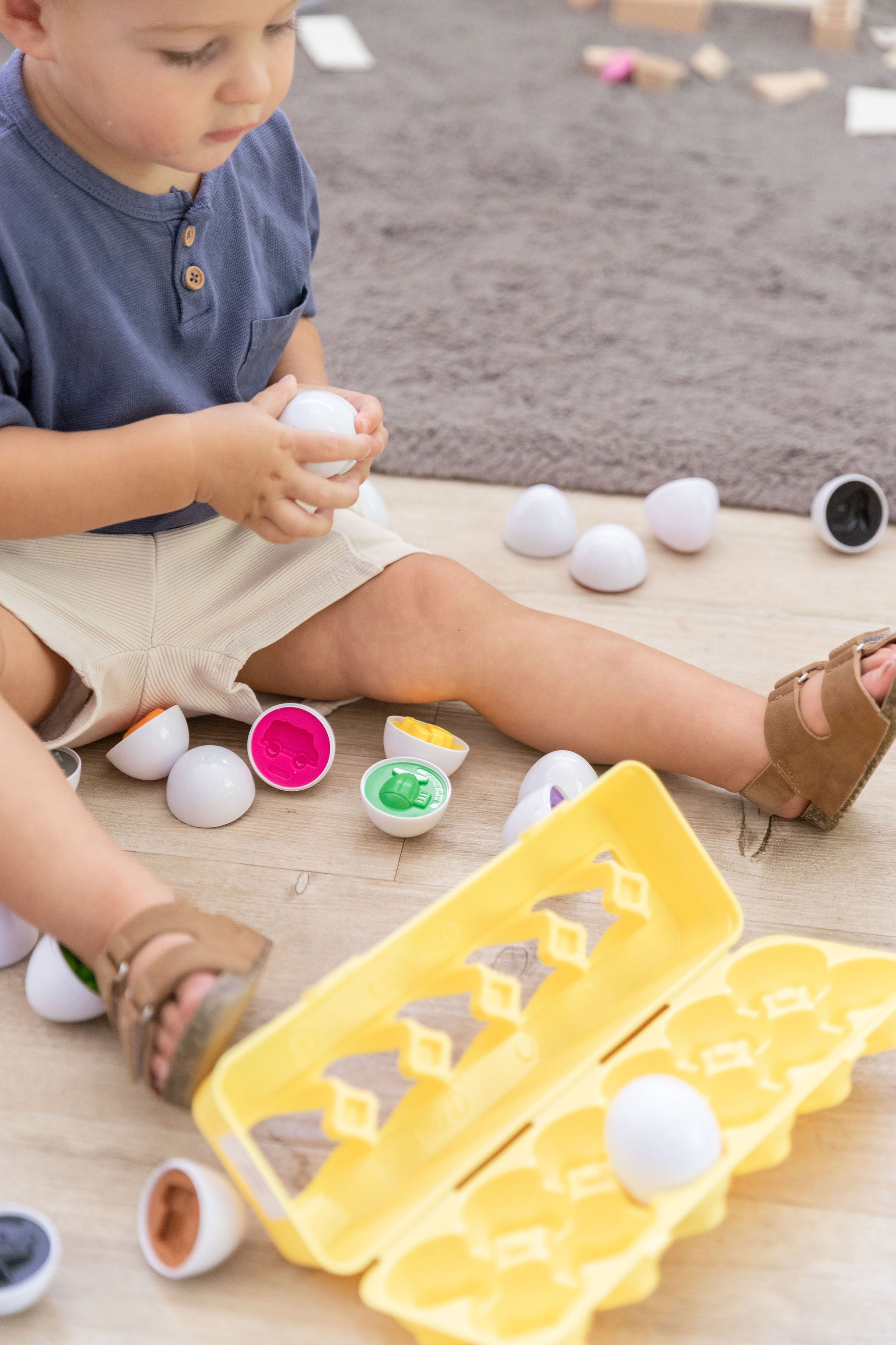 Egg Shapes toy in sensory tray - Easter gift idea for toddlers that supports shape and colour learning through play