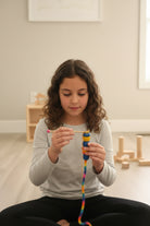 Girl doing french knitting