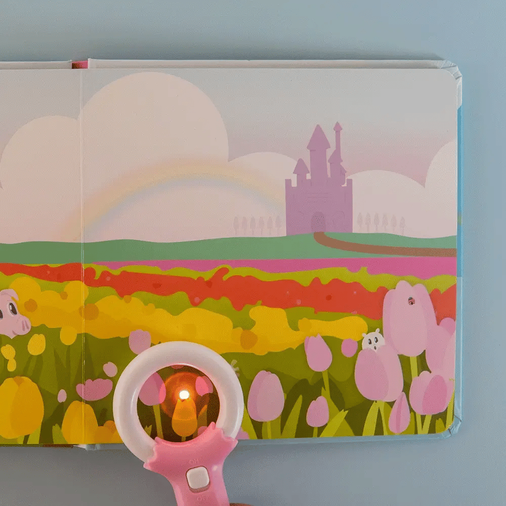 Children's book with colorful landscape illustration and a pink ring light on a blue background