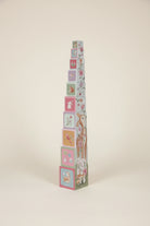 Stack of colorful children's blocks with animal illustrations on a white background
