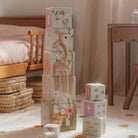 Stack of children's blocks with animal designs in a nursery setting