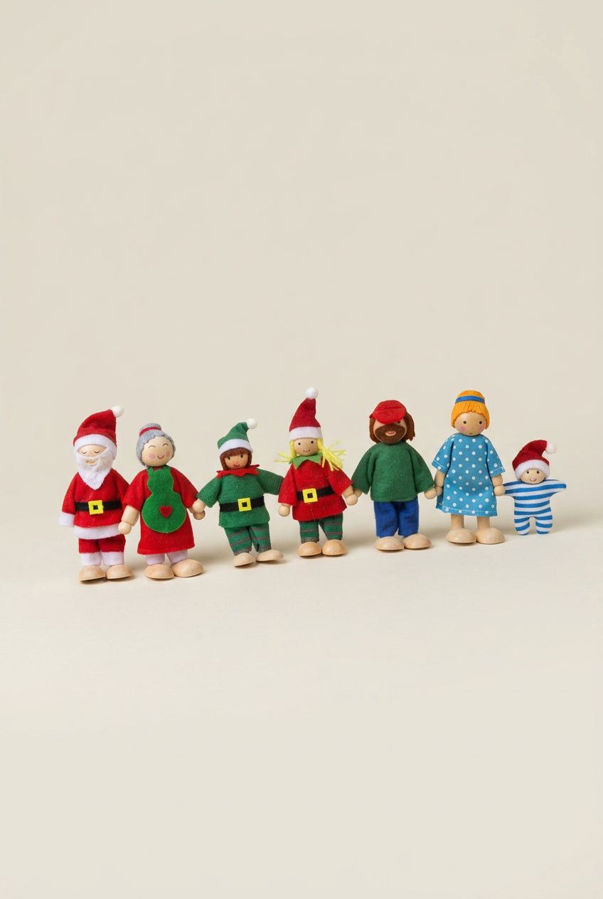 A set of seven wooden family dolls in Christmas attire, positioned against a neutral background.