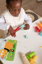 Red play-dough scissors for fine motor development